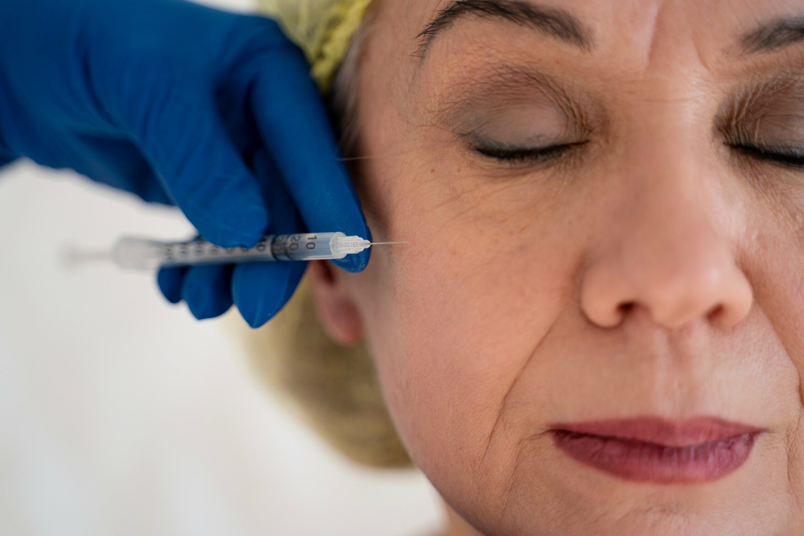 close-up-senior-woman-getting-injection
